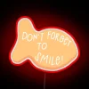 Vibrant neon decorative wall art features smiling goldfish design.