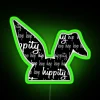 Easter-themed black neon sign featuring hoppy bunny design in RGB.