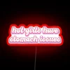 Unapologetic humor meets sass with 'Hot Girls Have Stomach Issues' neon.