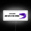 Colorful Neon Sign with Whimsical Quote about Life's Journey and Purpose