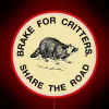 Vibrant 'I Brake For Critters' neon sign with colorful glow effects.