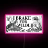 Ride with compassion: Support wildlife conservation with this colorful warning.