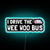 Colorful neon sign featuring whimsical bus driver design in RGB lighting.