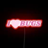 Illuminated neon sign featuring colorful insects in vibrant RGB lighting.