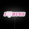 Glowing "I Love Bugs" neon sign with vibrant RGB colors.