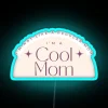 Neon 'Cool Mom' Sign, Unconventional Home Decor with Bold, Vibrant Lighting.