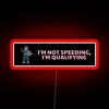 Defiant driver humor with 'I'm Qualifying' RGB neon sign