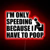 Humorous warning sign about emergency pooping needs, in neon color
