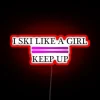 Sassy ski girl vibes radiate from this colorful neon sign.