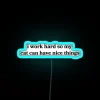 Whimsical Neon Sign Humorously Celebrates Feline Luxury Love and Hard Work