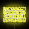 Colorful LED Sign Perfectly Capturing Feline Parenting's Joyful Priorities Vibrantly.
