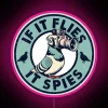 Irreverent humor meets surveillance satire in this quirky neon sign.