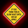 Humorous warning sign for slow moving vehicle with a twist