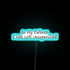 Whimsical 'In My Defense' Neon Sign with Colorful RGB Accents