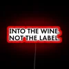 Quirky kitchen decor wall art with wine-themed humor and color.