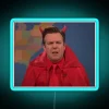 Jason Sudeikis' iconic Devil Disgusted face in vibrant RGB neon lighting.