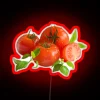 Colorful neon decor featuring vibrant Jersey tomatoes and basil illustration.