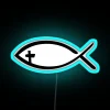 Neon illuminated symbol of faith featuring Jesus fish and cross.