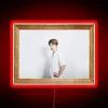 Vibrant Jimin portrait illuminated by colorful RGB neon lights glow