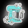 Neon kitchen decor mixer with floral design and colorful accents.