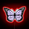 Soft glow of a delicate lavender butterfly in neon lights