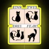 German language learning aid with colorful cat-themed LED display board