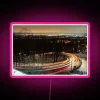 RGB Neon Road Sign with Wavy Light Trail Design
