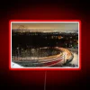 RGB Neon Sign Displaying Curved Road with Glowing Light Trails