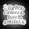 Taylor Swift's iconic lyrics in bold neon colorful lettering display.