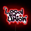 Rebellious neighborhood art statement with bold, eye-catching RGB neon accents.