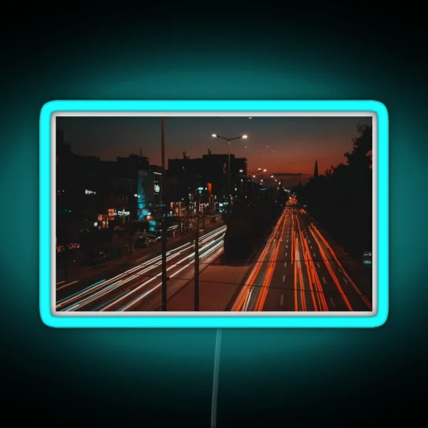 Long Exposure Of Busy Street RGB Neon Sign