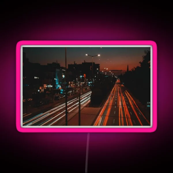 Long Exposure Of Busy Street RGB Neon Sign