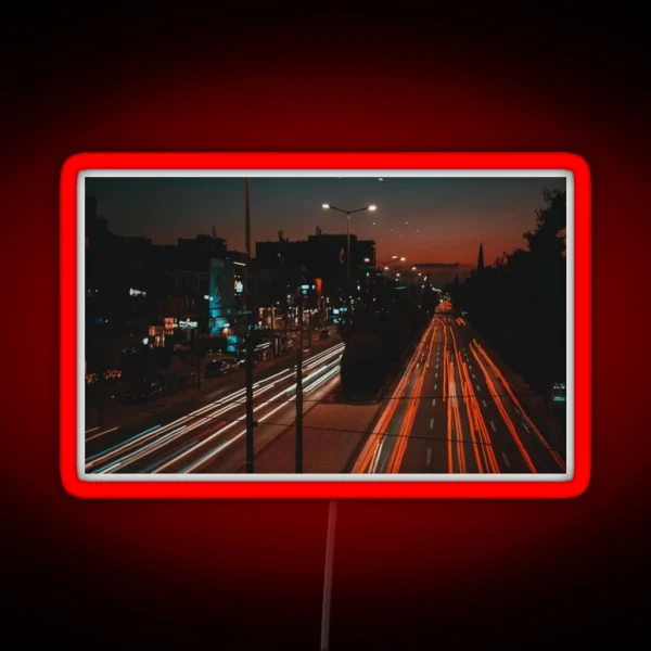 Long Exposure Of Busy Street RGB Neon Sign