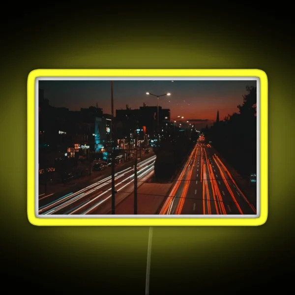 Long Exposure Of Busy Street RGB Neon Sign