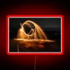 Neon-illuminated cityscapes captured in vibrant color through time-lapse exposure techniques