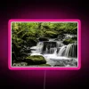 Vibrant waterfall display with mesmerizing long exposure RGB LED lighting effects.