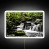 Captivating long exposure waterfall scene with vibrant color LED accents