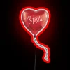 Electric rainbow glow of Matilda balloon in vibrant neon display