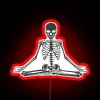 Neon glow of a serene meditating skeleton in vibrant colors.