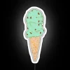 Neon glow of sweet treat temptation under colorful night lights.