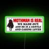 Mothman themed wall decor with colorful RGB lighting accents installed indoors.