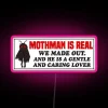 Displaying whimsical humor with glow-in-the-dark, neon MOTHMAN enthusiast decor.