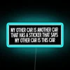 Quirky home decor boasting humorous neon sign of car obsession.