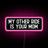 Humorous neon biker sign with cheeky reference to motherly love.