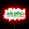 Whimsical neon sign features green script with humorous motivational phrase.