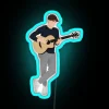 Neon Sign Featuring Niall Horan Playing Guitar in Vibrant Colors