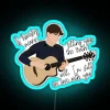 Neon band logo decor featuring One Direction's Niall Horan stills.