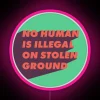 RGB neon sign advocating human rights and territorial sovereignty awareness.