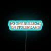 Activist statement wall decor promoting migrant rights and indigenous sovereignty awareness