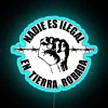 Neon activism statement against borders and colonialism on native territories